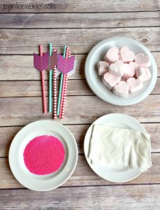 Easy Valentine treat: Cupid's Marshmallow Arrows with dipped and coated heart marshmallows on an arrow straw!