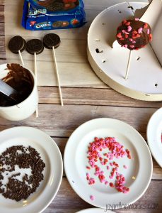 There is no better combination for Valentine's Day than strawberries and chocolate and these Valentine Oreo Pops using Chocolate Strawberry Oreos are an easy way to enjoy these flavors in a decadent Valentine's Day treat!