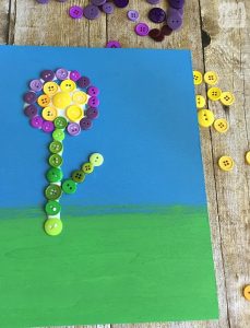 Looking for a creative DIY Mother's Day Gift or just a beautiful work of art? This button flower art project is surprisingly easy and sure to impress! It's a great homemade gift idea that an adult or an older child can make!